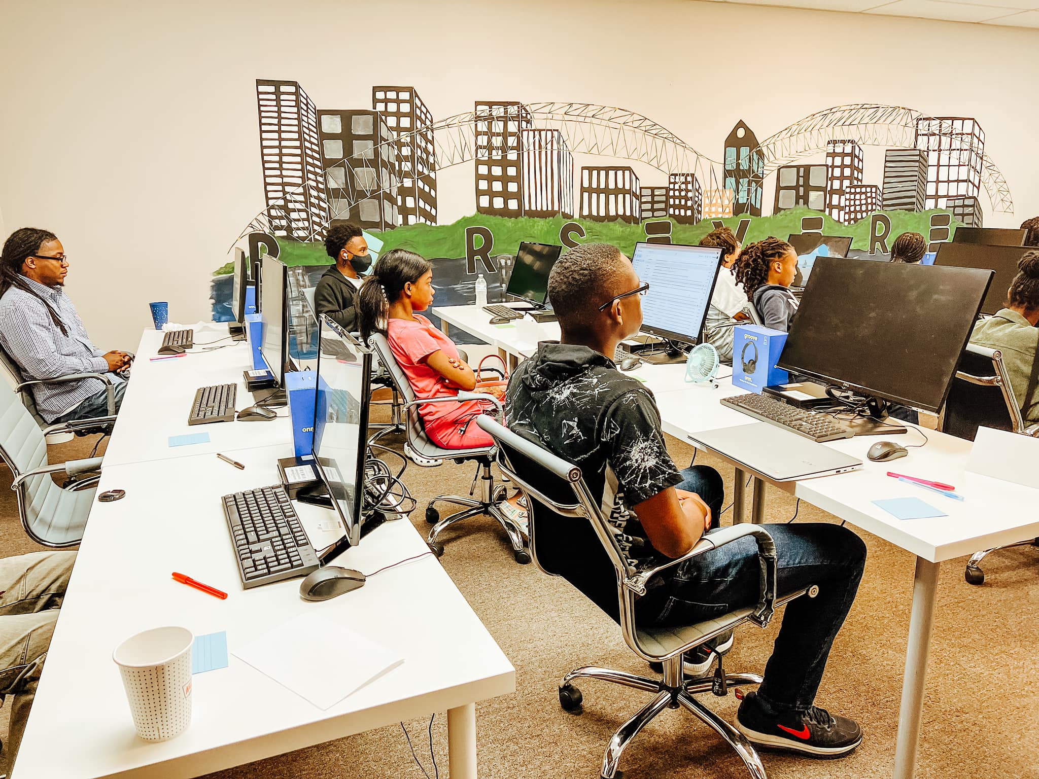 Persevere classroom with young students learning technology