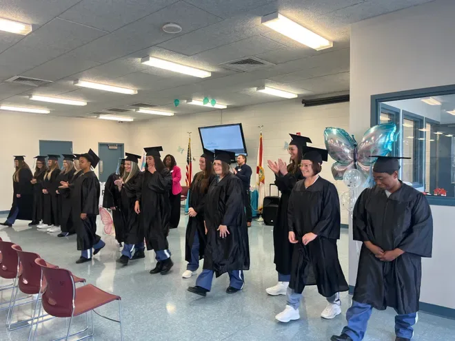 Persevere graduate celebrating program completion